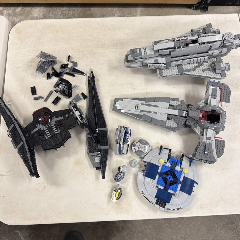 collection of partially disassembled LEGO Star Wars sets